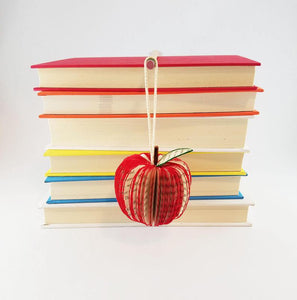 Hanging handmade book ornament in shape of apple